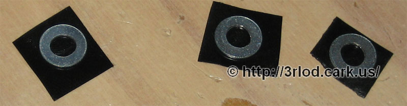 Metal washers with electrical tape on one side to help prevent against short circuits on the mainboard.