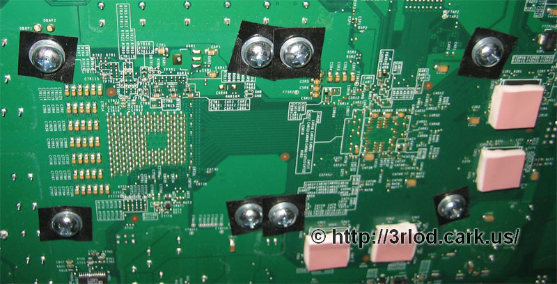 All 8 bolts and metal washers from the underside of the xbox mainboard. Ready to move on to the top side of the mainboard.