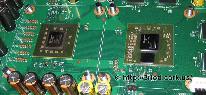 The top side of the mainboard with the bolts sticking through.